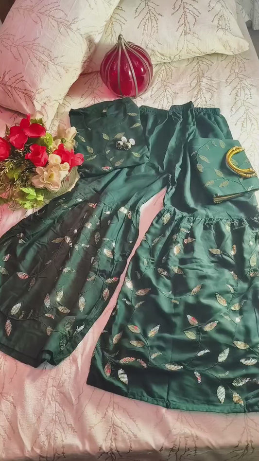 Beautiful Bottle green Heavy sequence work party wear sharara suit with matching purse.